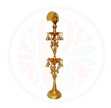 a tall brass candle holder with a fan