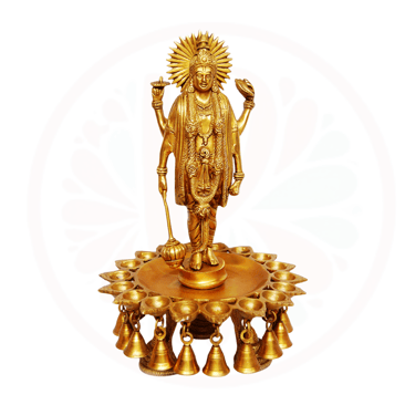a statue of a vishnu holding a candle and a candle