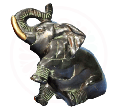 a statue of an elephant with a gold ring