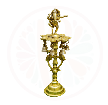a gold candle holder with a horse and bells