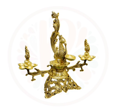 a brass bellows with a peacock on it