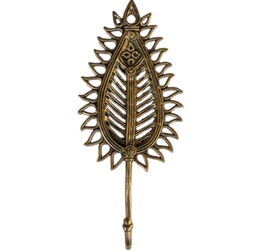 a decorative metal hook hook with a leaf design