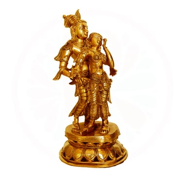 a golden statue of aradha krishna