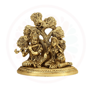 brass radha krishna sitting under the tree