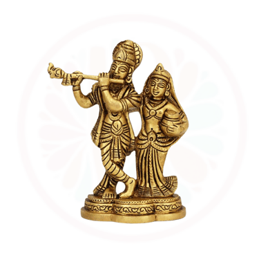 a statue of a krishna and radha playing flute