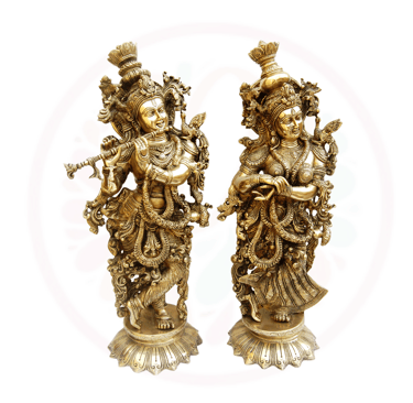a pair of two statues of hindu deities