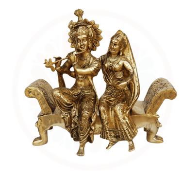 a couple of statues of aradha krishna sit