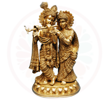 a golden statue of a couple playing flute