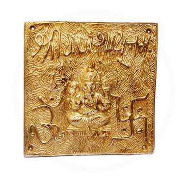 a plaque with a gold plated plaque of a buddha statue