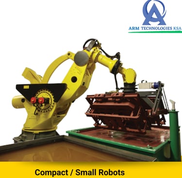 Yellow industrial robotic arm performing precision automated manufacturing for ARM Technologies KSA.