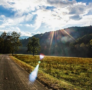 a road with a view of the Great Smoky Mountains