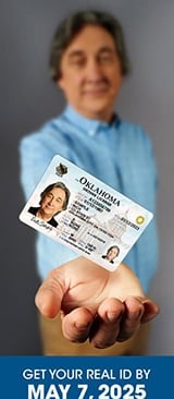 a person holding a card with a picture of a person