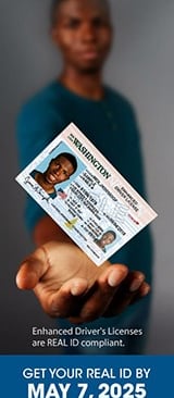 a man holding an id card