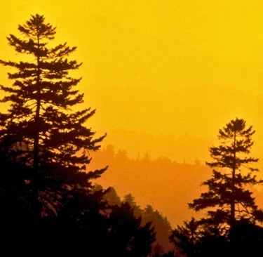 a sunset over a mountain