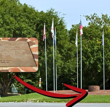 a plaque with a trail map and several flags in a circle