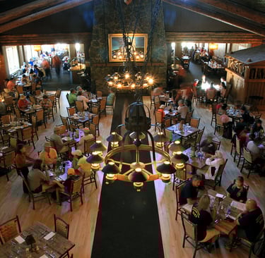 a restaurant with a large group of people sitting at tables