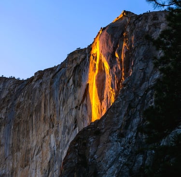 a waterfall flowing down a cliff face