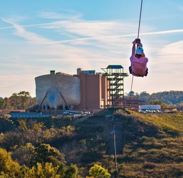 a person is hanging from a zipline