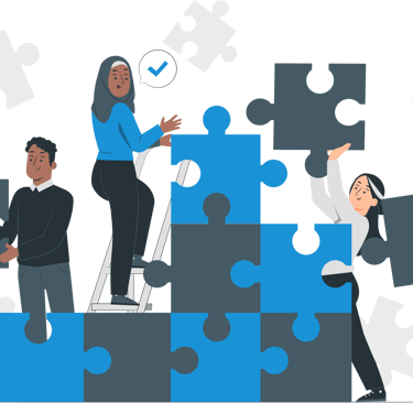 a group of people standing around a puzzle piece of puzzle pieces