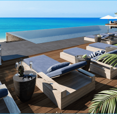 a deck with lounge chairs and umbrellas