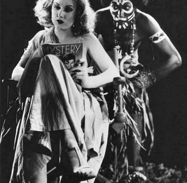 Fay Wray and Noble Johnson pose inbetween scenes