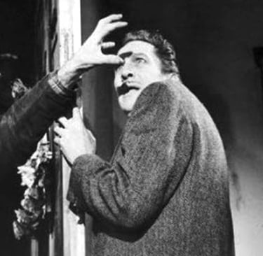 Vincent Price wards off the vampires. The Last Man on Earth (1964)