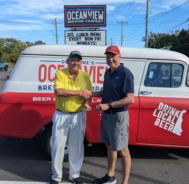 Jeff Paniati receiving Mini-Guinea Trophy from Jeff Lindley
