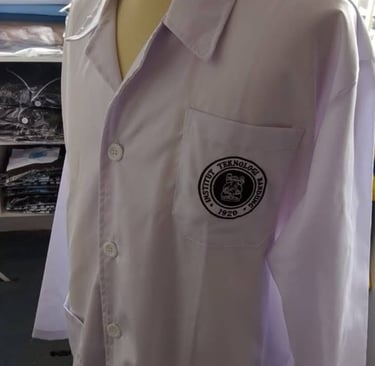 White long-sleeved lab coat with Fuel Salt Tech Laboratory logo displayed on a mannequin.