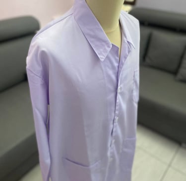 A white long-sleeved lab coat with the Institut Teknologi Bandung ITB logo on the pocket.