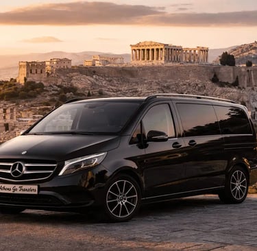 Luxury Mercedes-Benz Vito W447 by Athens Go Transfers parked at a scenic viewpoint overlooking the Acropolis in Athens Greece