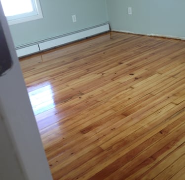 Refinished hardwood floors in bedroom