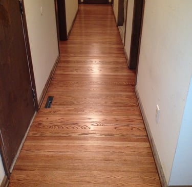 Refinished hardwood floors in hallway