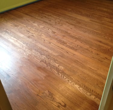 Refinished hardwood floors in bedroom