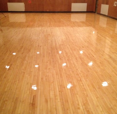 Refinished hardwood floors in gymnasium 