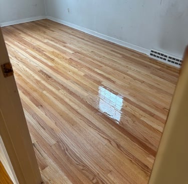 Refinished hardwood floors in bedroom