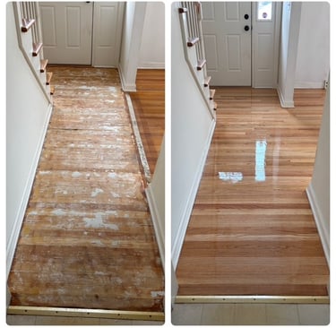 Refinished hardwood floor with old glue in entry way