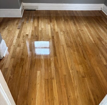 Refinished hardwood floors with repair in bedroom