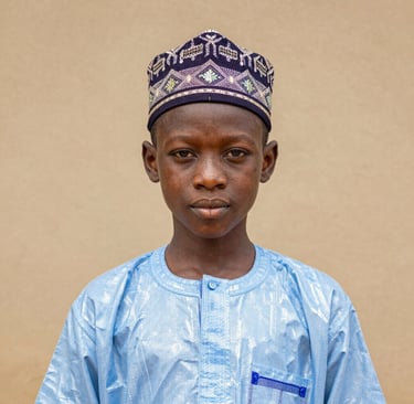 A sculptural piece made from reclaimed metal, reflecting light and shadow in dynamic patterns.