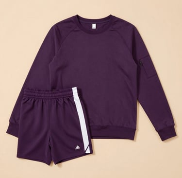 Minimalist product display of lavender-toned sportswear and wellness supplements on a clean white background