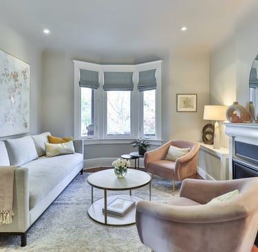 luxury pastel and white lounge room with bay window. Well lit..