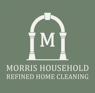Morris Household logo. White archway with capital M.