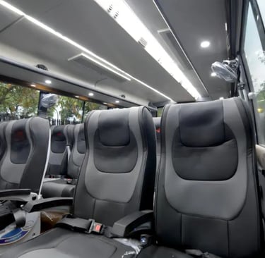 29 seater luxury bus interior for group travel in Delhi by Bus Suvidha