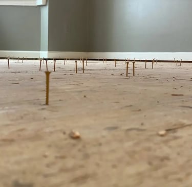 re-screwing subfloor.