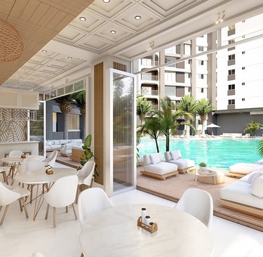 Open-air resident lounge and cafe area overlooking the pool deck