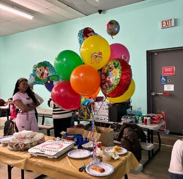Birthday party setup with pizza and decorations at Yum Yum Fun family entertainment center