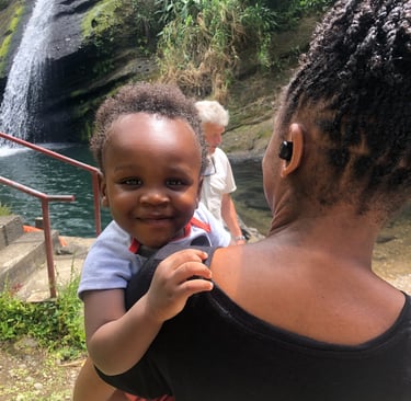 infant and adult at the Concord waterfall