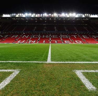 Floodlights lit at Old Trafford at the half-way line