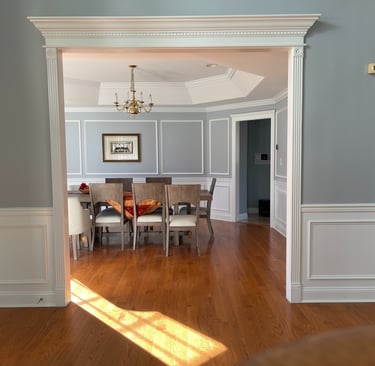 Custom wainscoting, wall frames, and decorative trim in a Monmouth County dining room