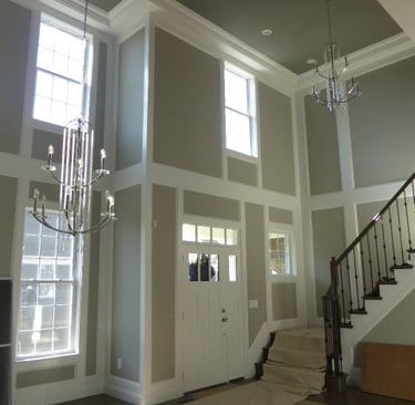 Two-story foyer wainscoting and crown molding installation in Monmouth County NJ