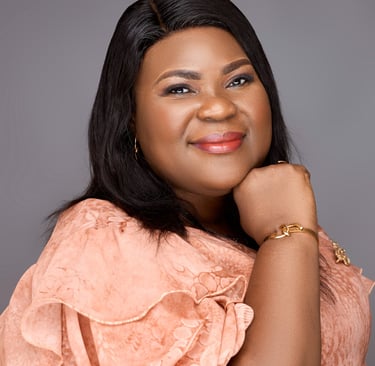 a woman in a pink dress and gold jewelry